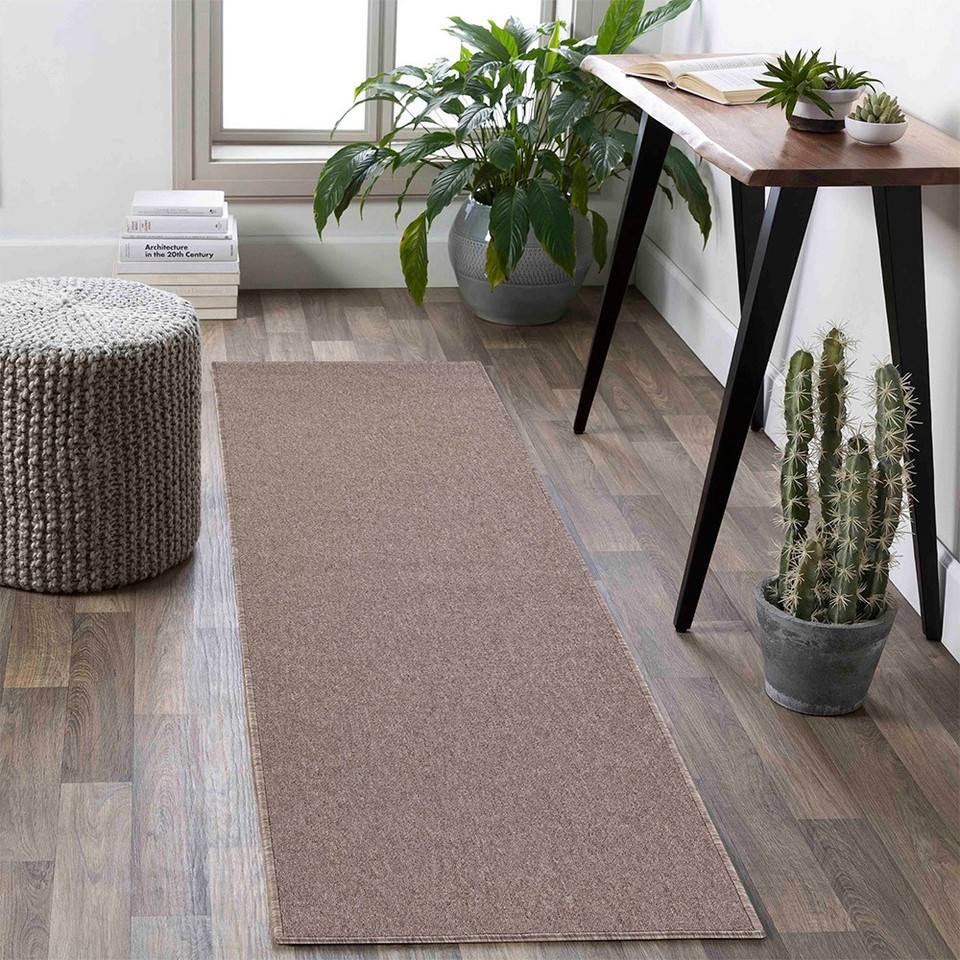 plain low pile dark beige rug runner in a living space