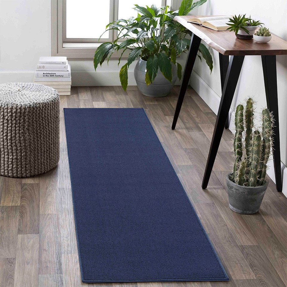 plain low pile navy rug runner in a living space
