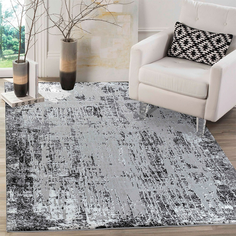 modern abstract abrasion black rug in a living room