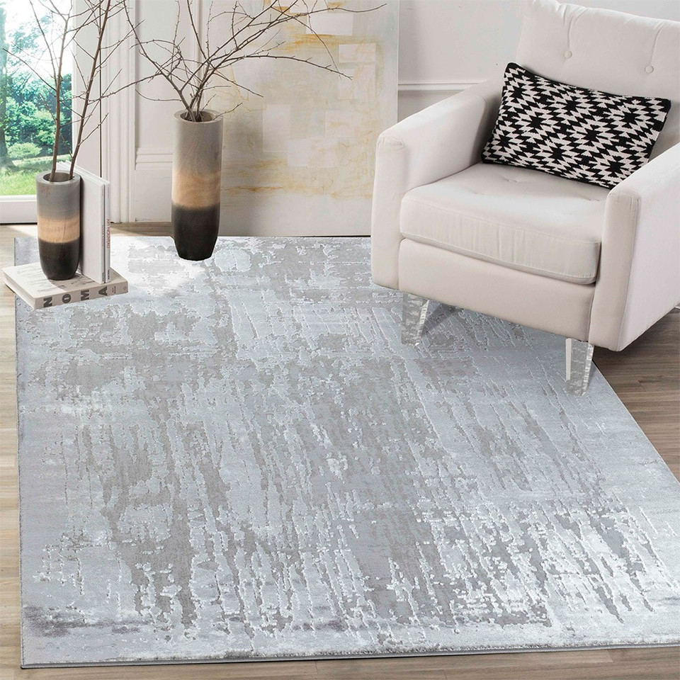 modern abstract abrasion grey rug in a living room