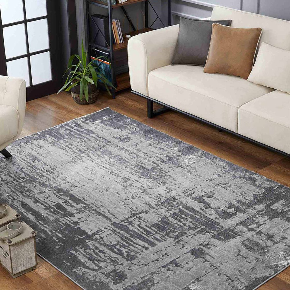 modern abstract abrasion grey rug in a living room