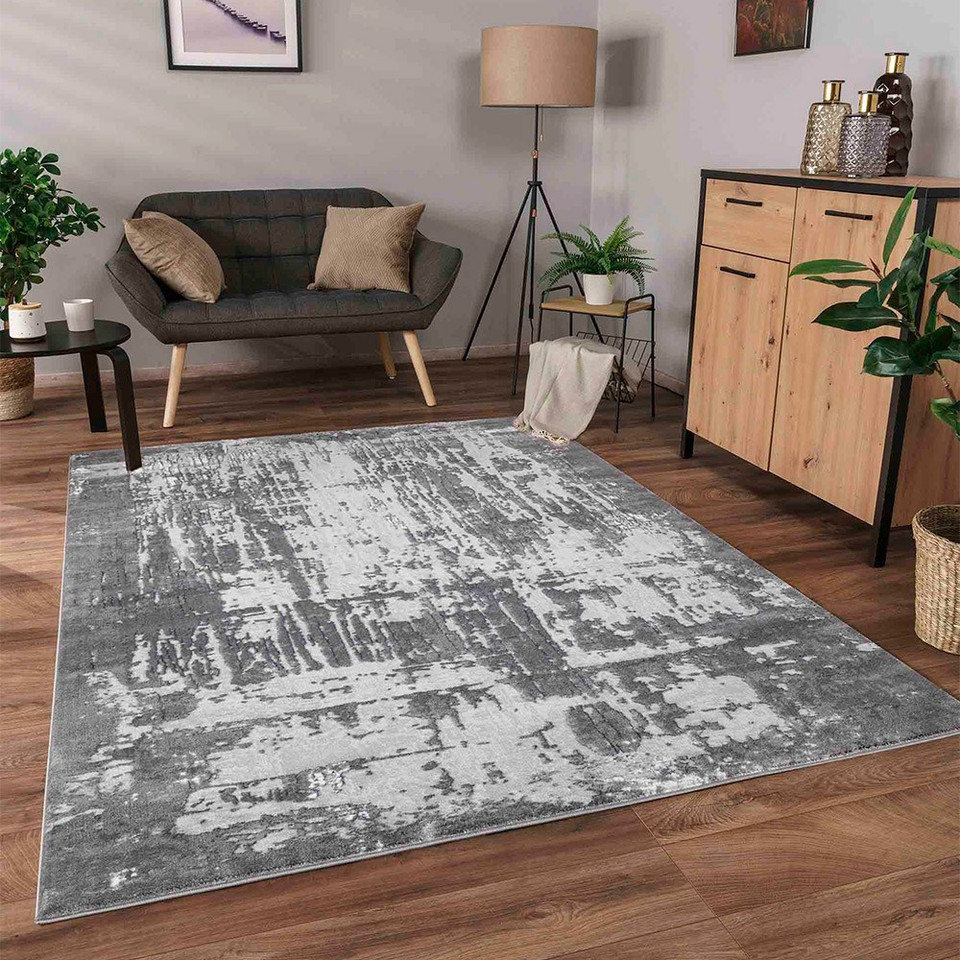 modern abstract abrasion grey rug in a living room