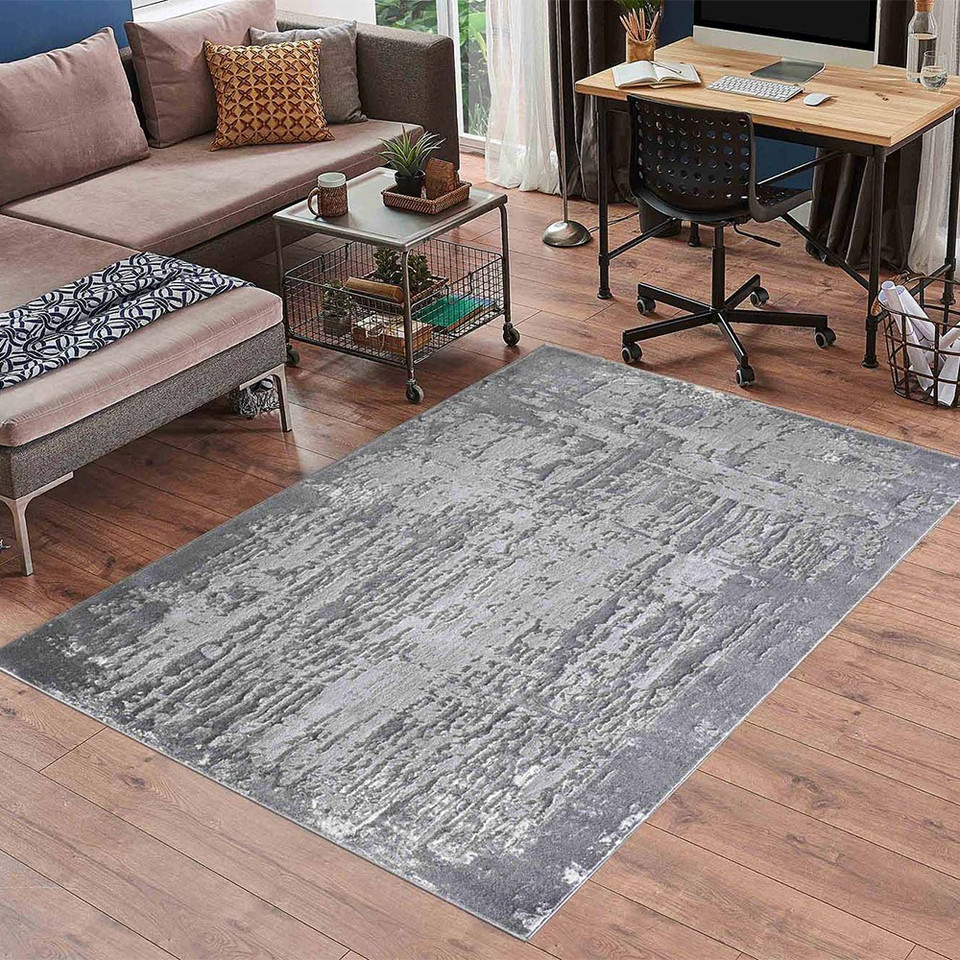 modern abstract abrasion grey rug in a living room