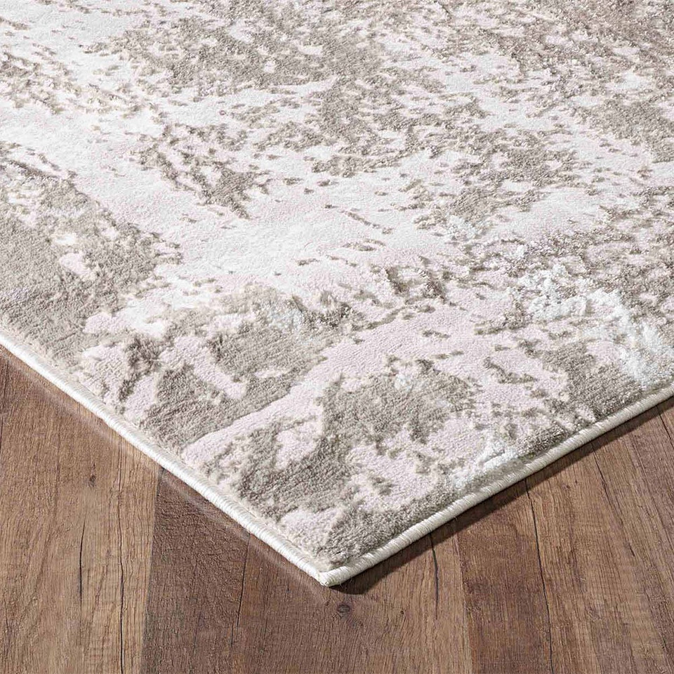 modern abstract abrasion stone rug runner closeup corner on a wooden floor