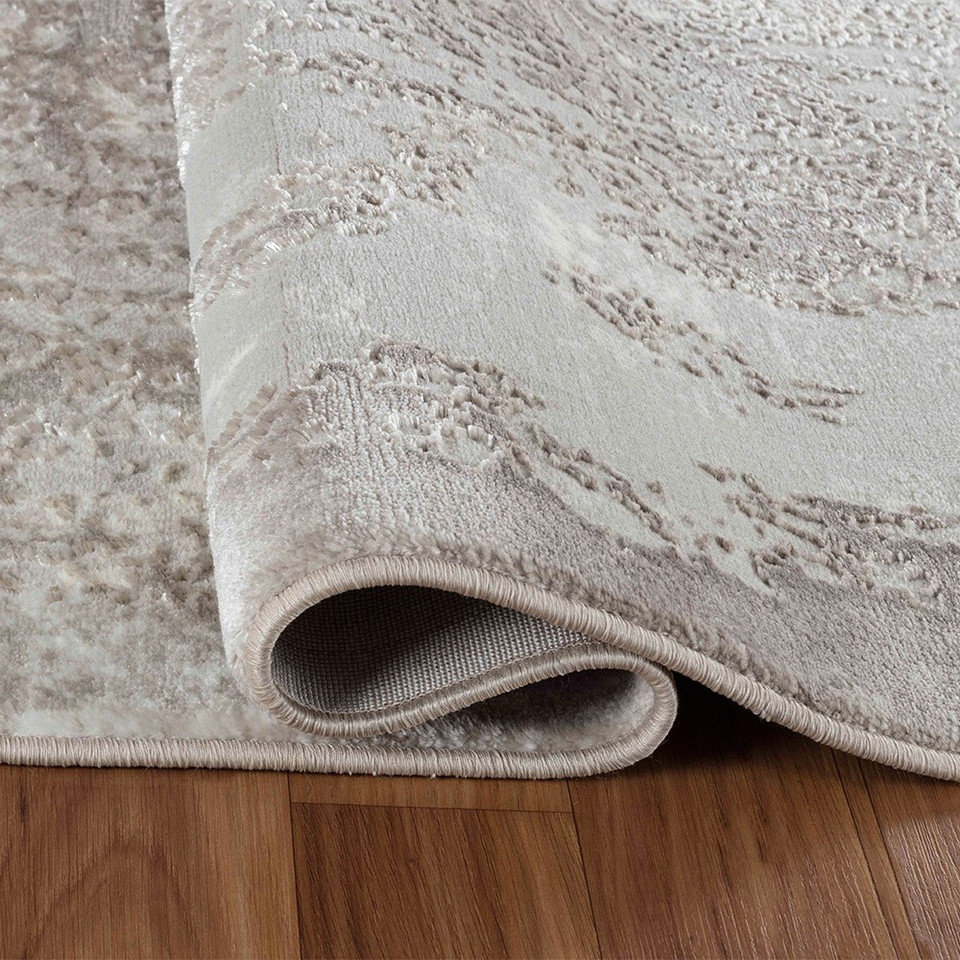 modern abstract acrylic stone rug runner folded on wooden floor