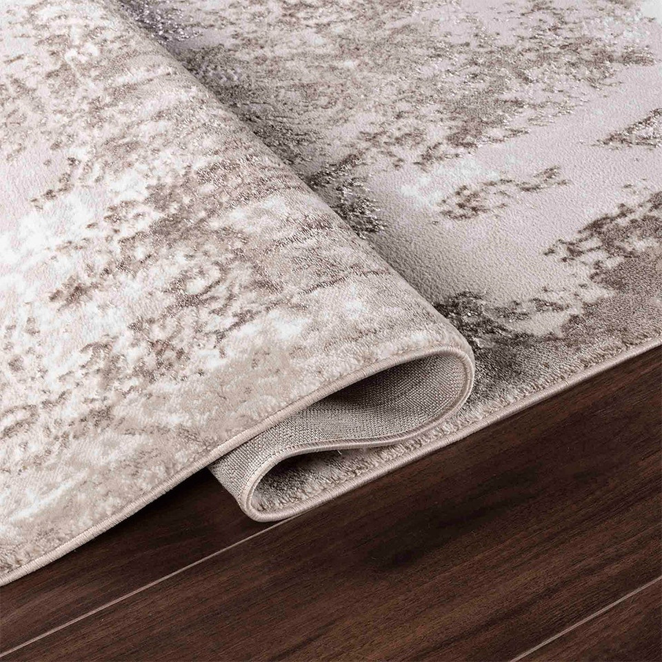 modern abstract acrylic stone rug runner folded on wooden floor