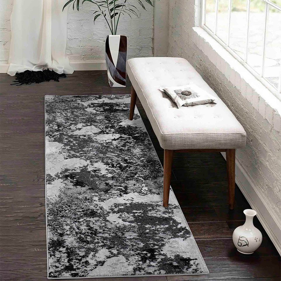 modern abstract sprayed black rug runner in a hallway