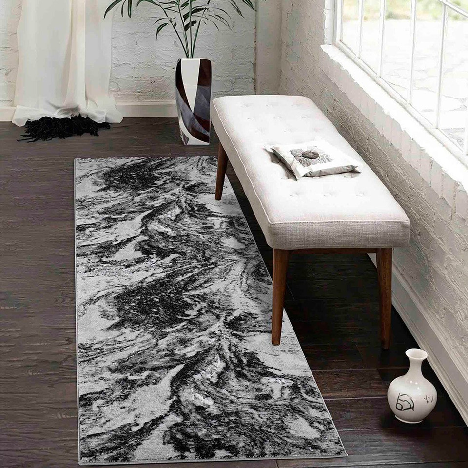 modern abstract water flow black rug runner in a hallway