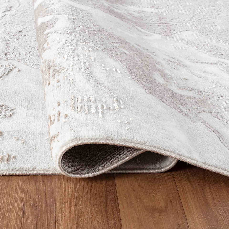 modern abstract water flow stone rug folded on wooden floor