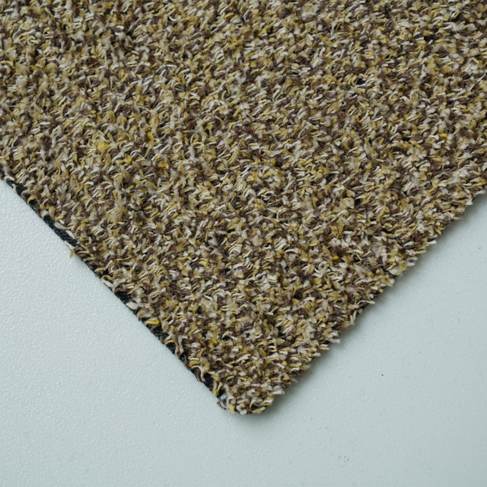 beige dirt trapper doormat closeup corner