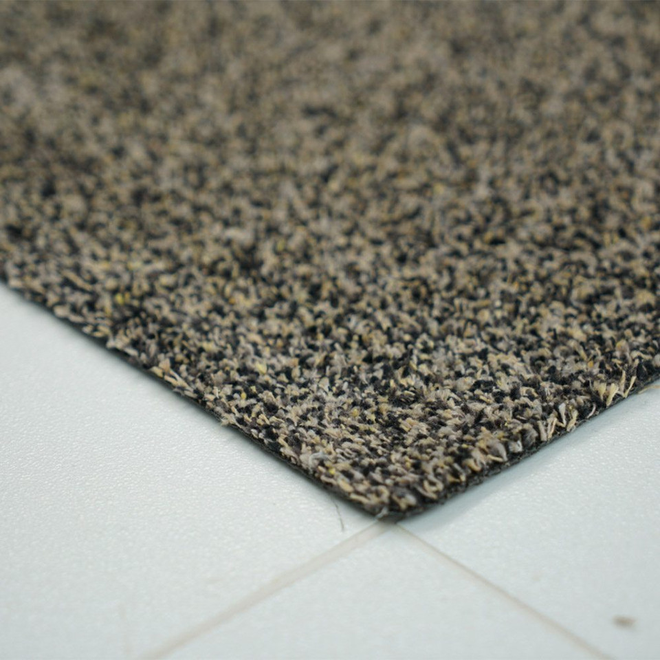 brown dirt trapper doormat closeup corner