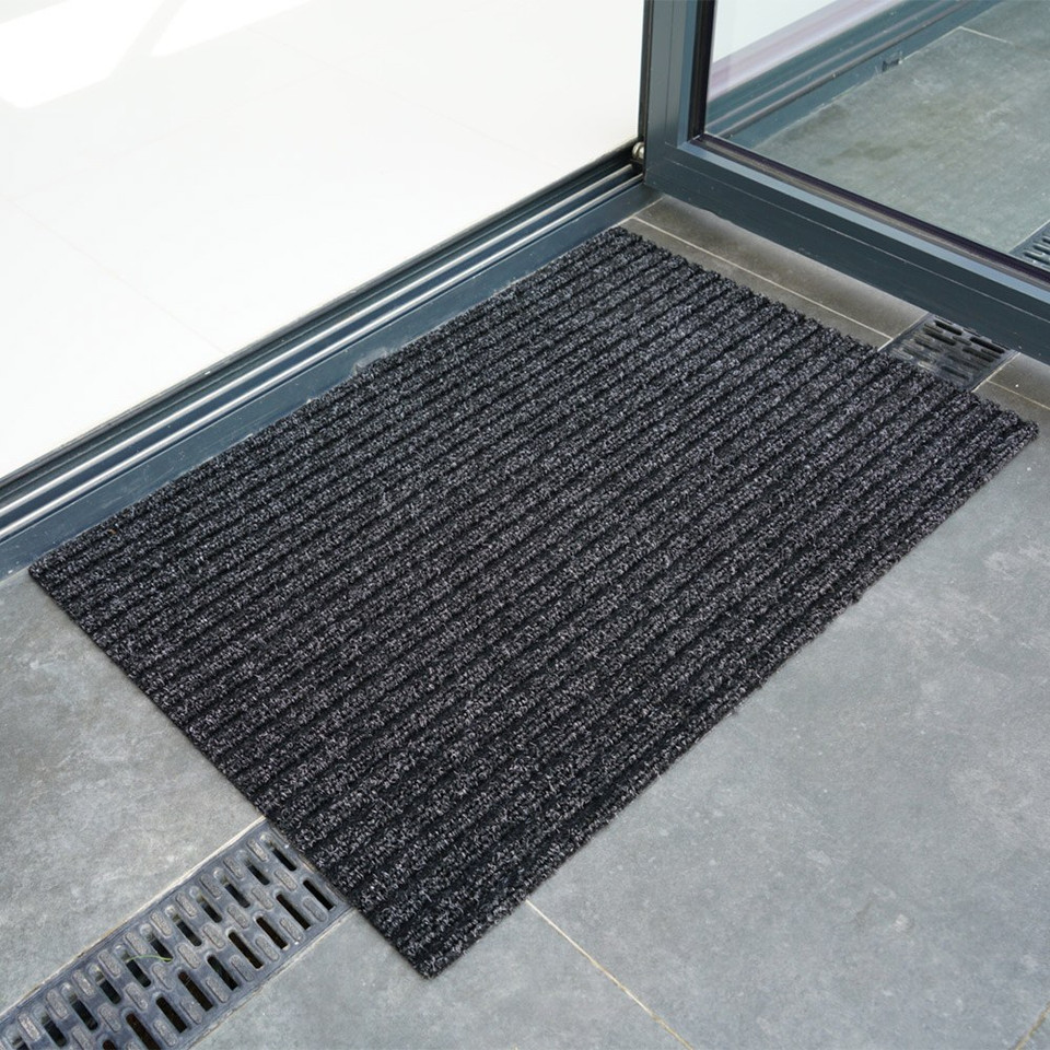 anthracite coir doormat infront of doorway outdoors