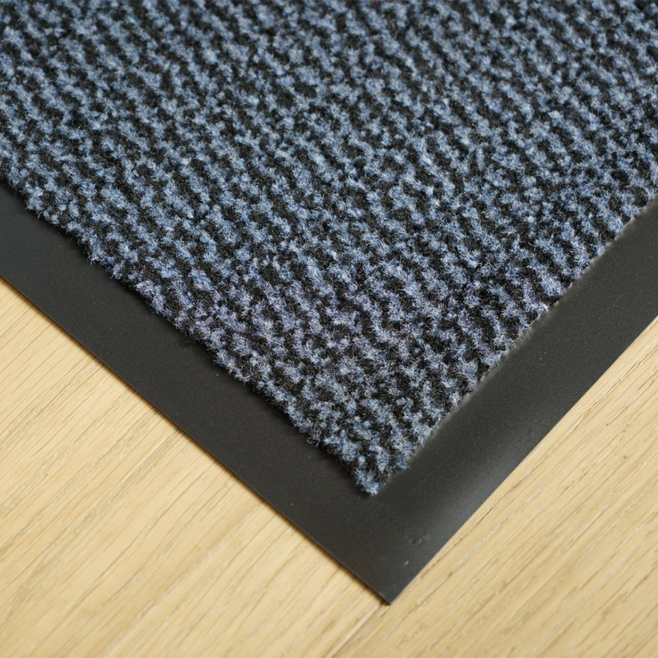blue non-slip dirt trapper mat closeup corner on wood floor
