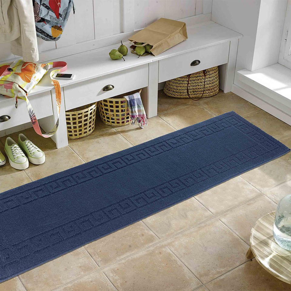 greek key navy doormat runner in a living room