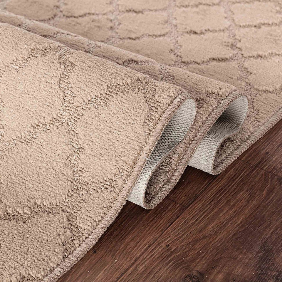trellis beige doormat folded on wooden floor