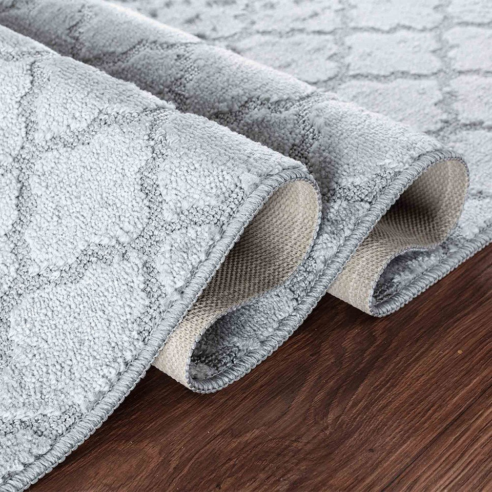 trellis dark grey doormat folded on wooden floor