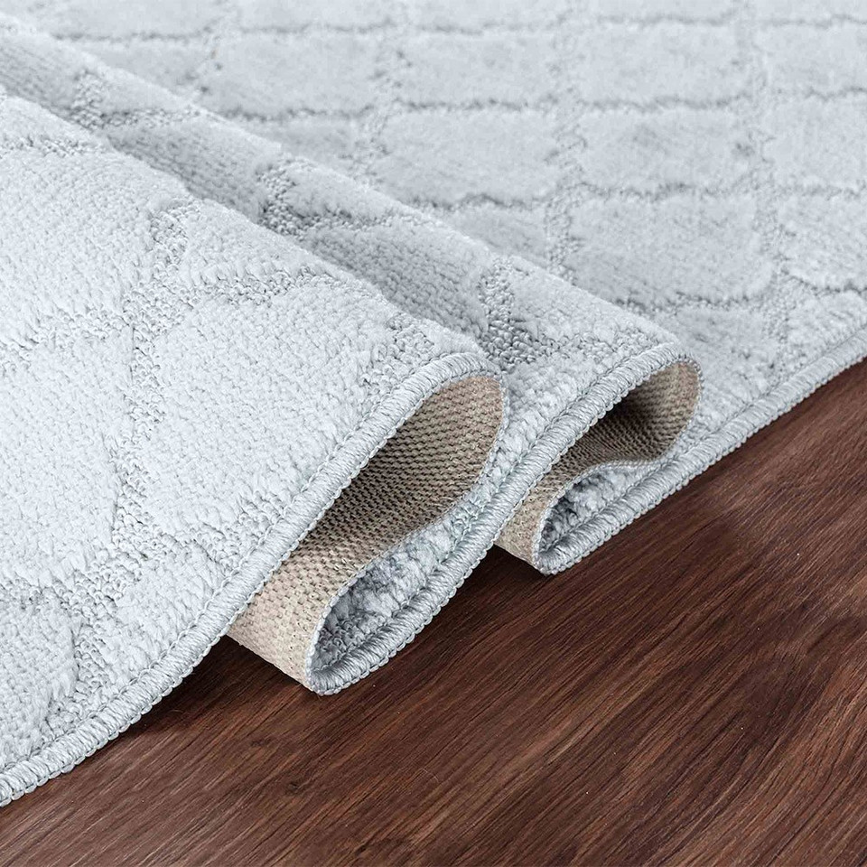 trellis silver doormat folded on wooden floor