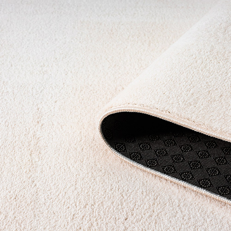plain white rug runner partially rolled