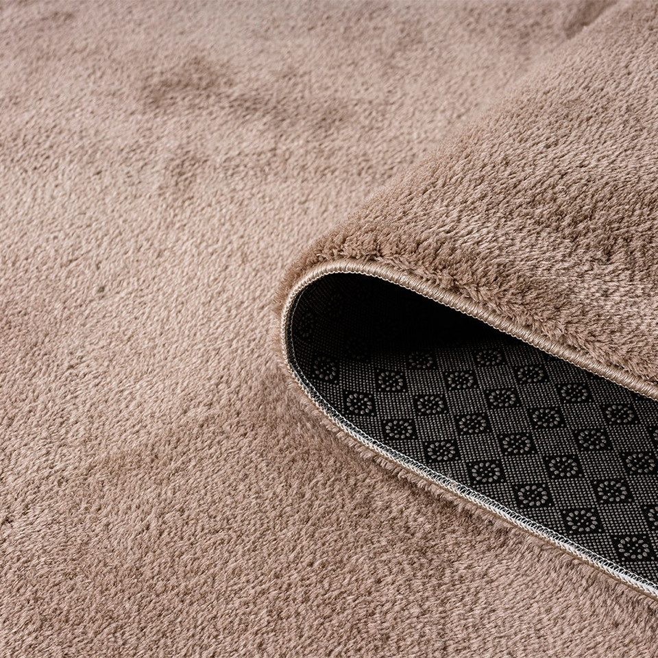 plain beige rug runner partially rolled