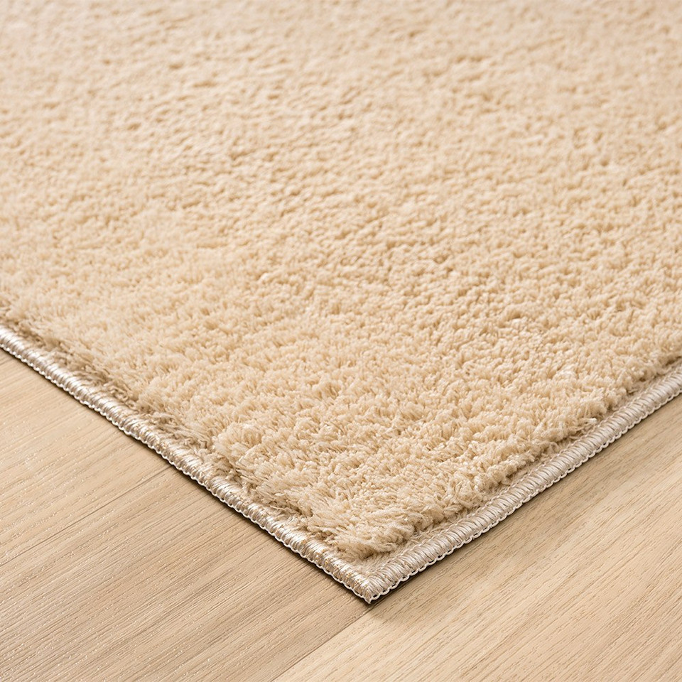 plain beige rug runner side view of corner