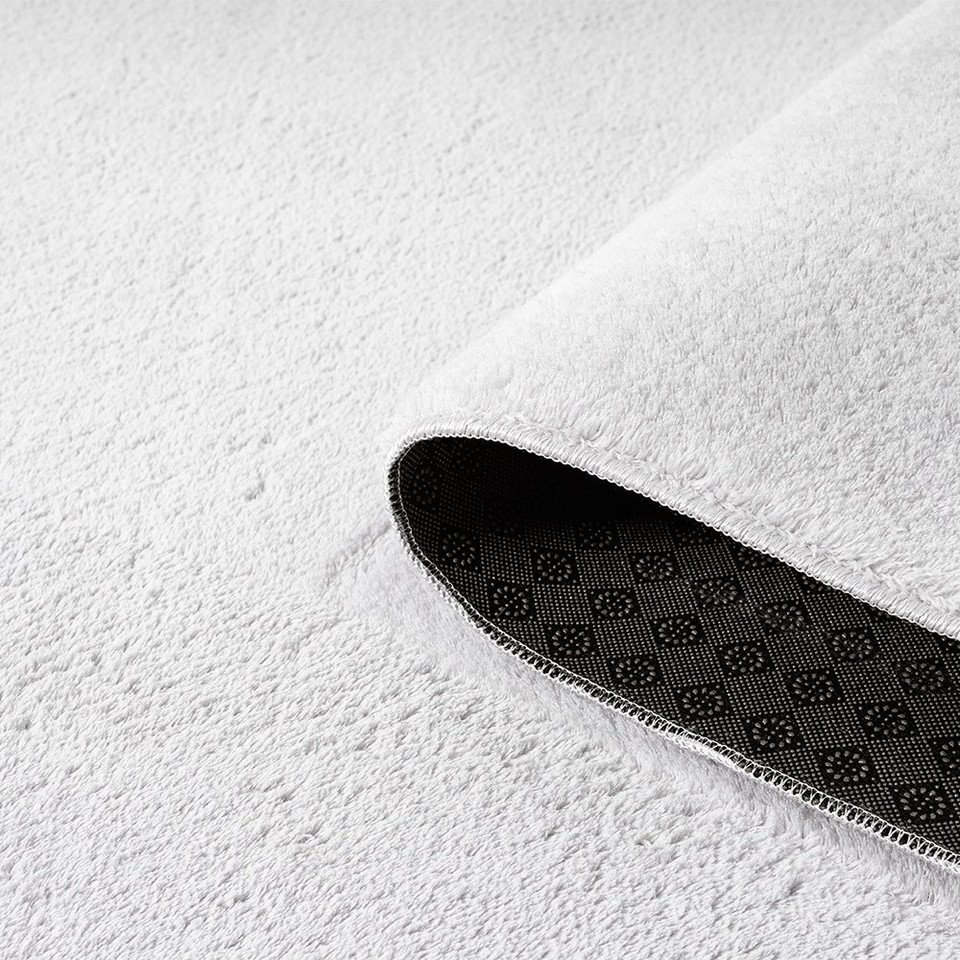 plain silver rug runner partially rolled