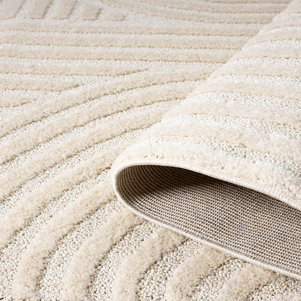 cirque cream rug closeup with fold