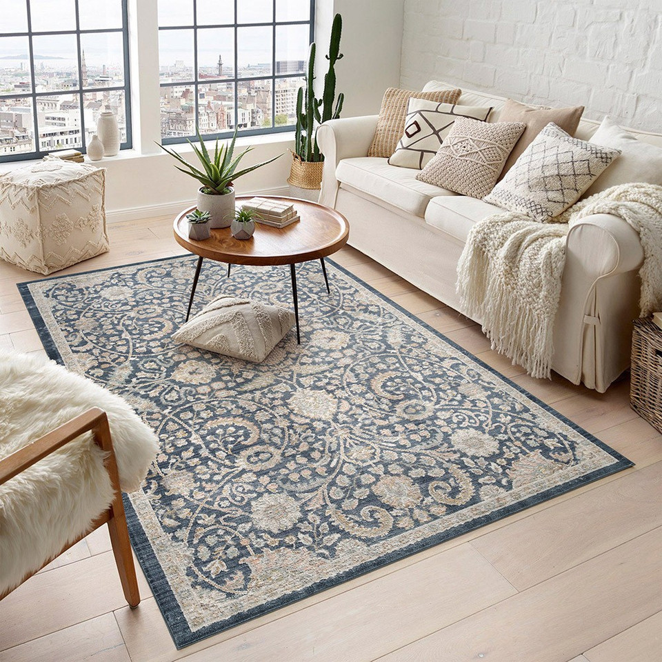 traditional floral navy rug in a living room