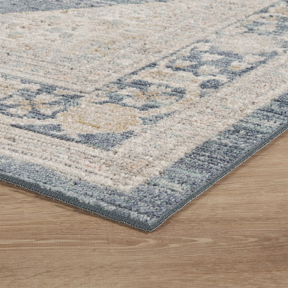 traditional floral navy rug side angle closeup corner