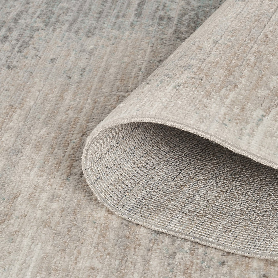 abstract grey rug closeup rolled