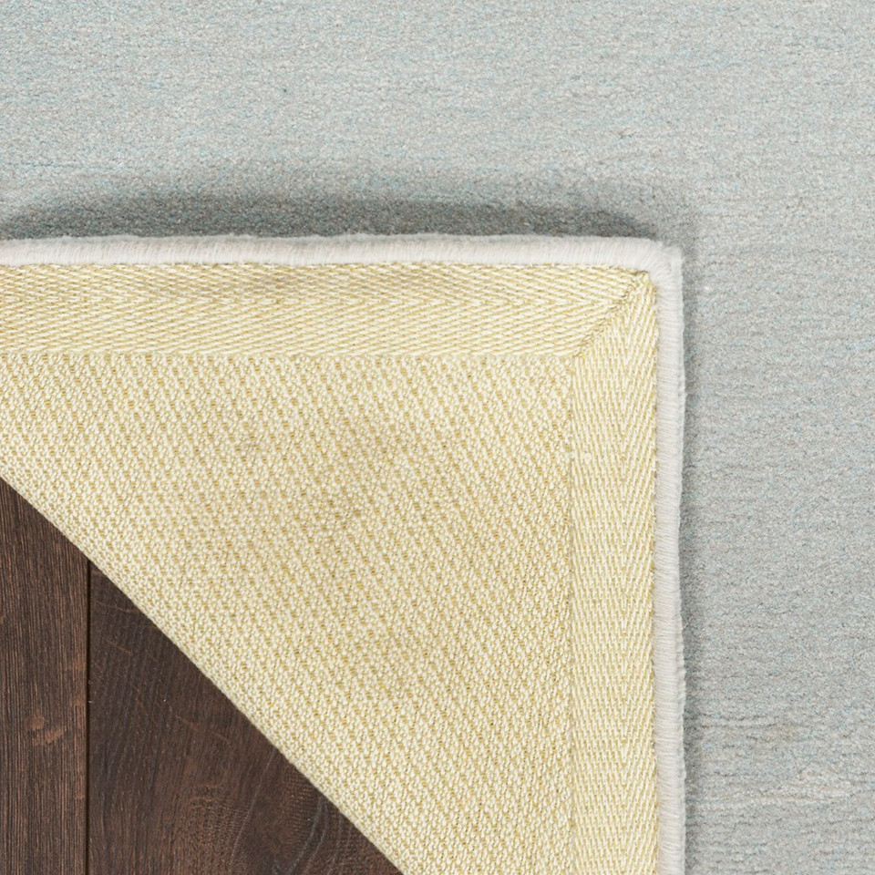 grey seafoam abstract rug closeup of corner folded
