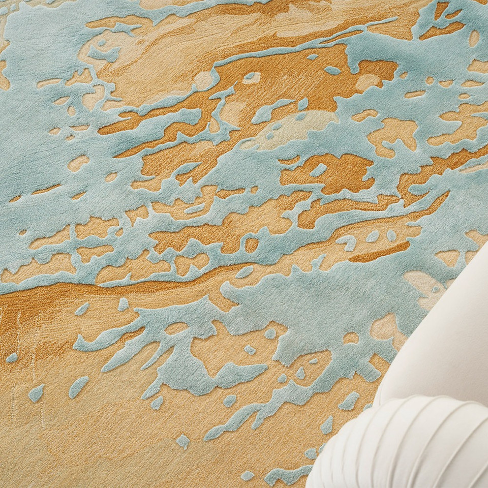 sand blue abstract rug closeup pattern next to a sofa