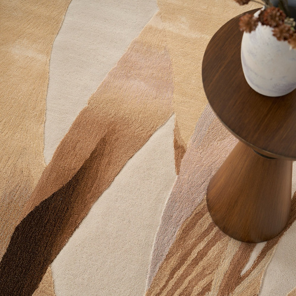 sand abstract rug closeup pattern with a plant