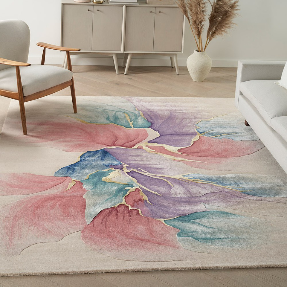 ivory floral rug in a living room with furniture