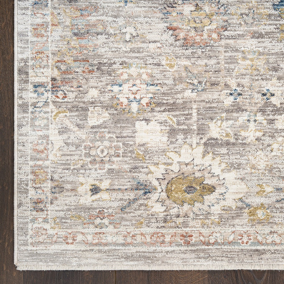 grey traditional rug closeup corner on dark wood floor