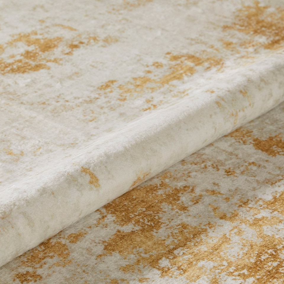 light gold abstract rug closeup rolled