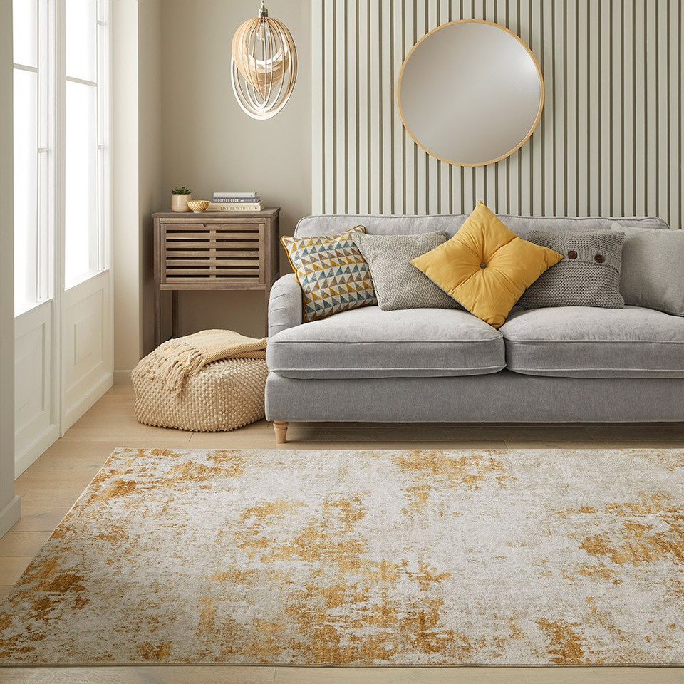 light gold abstract rug in living room with a matching decor
