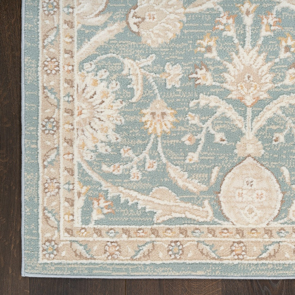 blue traditional rug closeup corner with dark wood floor