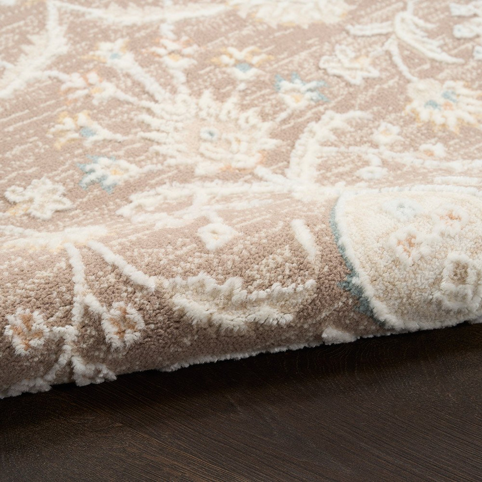 brown traditional rug closeup rolled with dark wood floor