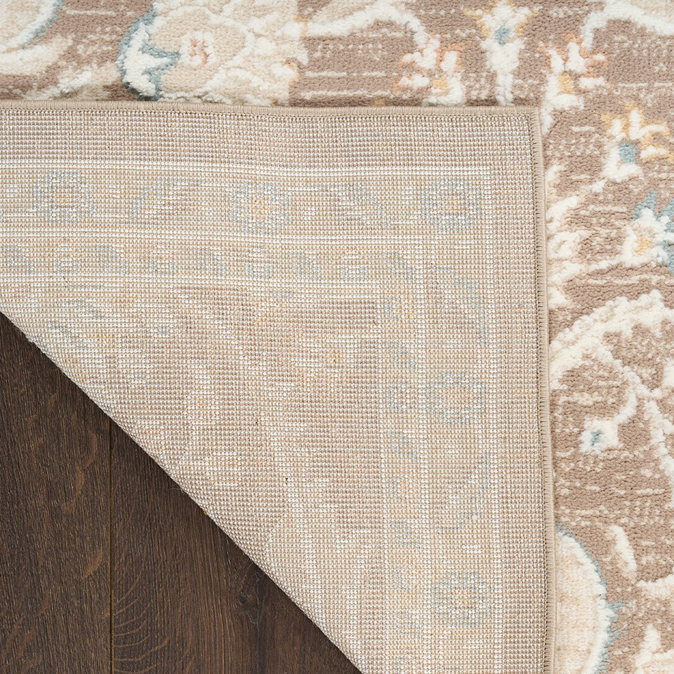 brown traditional rug closeup corner fold with dark wood floor