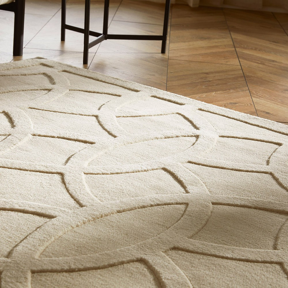 ivory wool rug closeup on wood floor