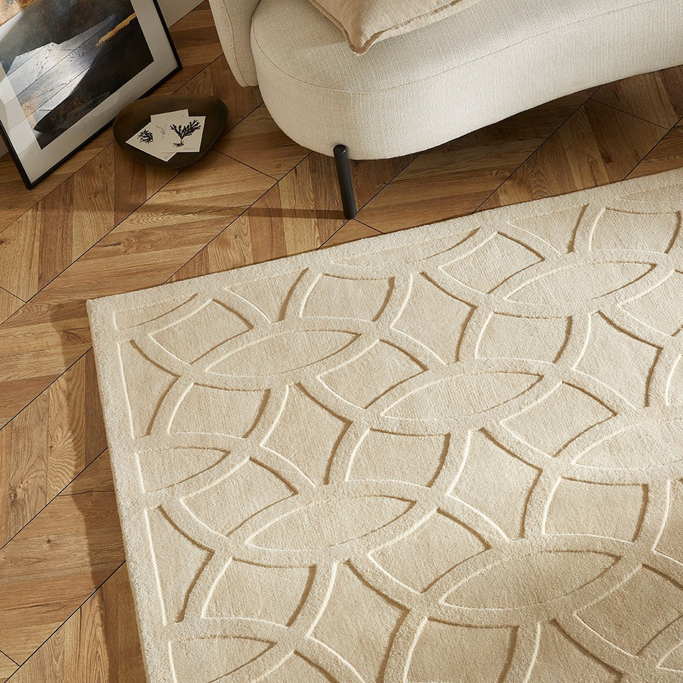 ivory wool rug closeup corner on wood floor