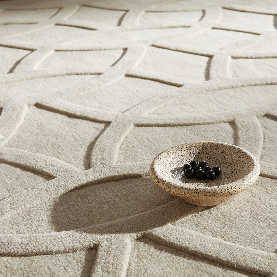 taupe wool rug closeup with a bowl
