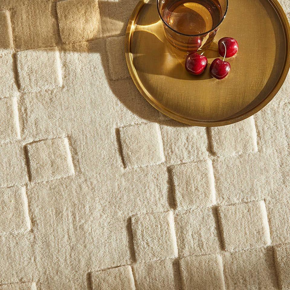 ivory wool rug closeup corner with bowl of fruit