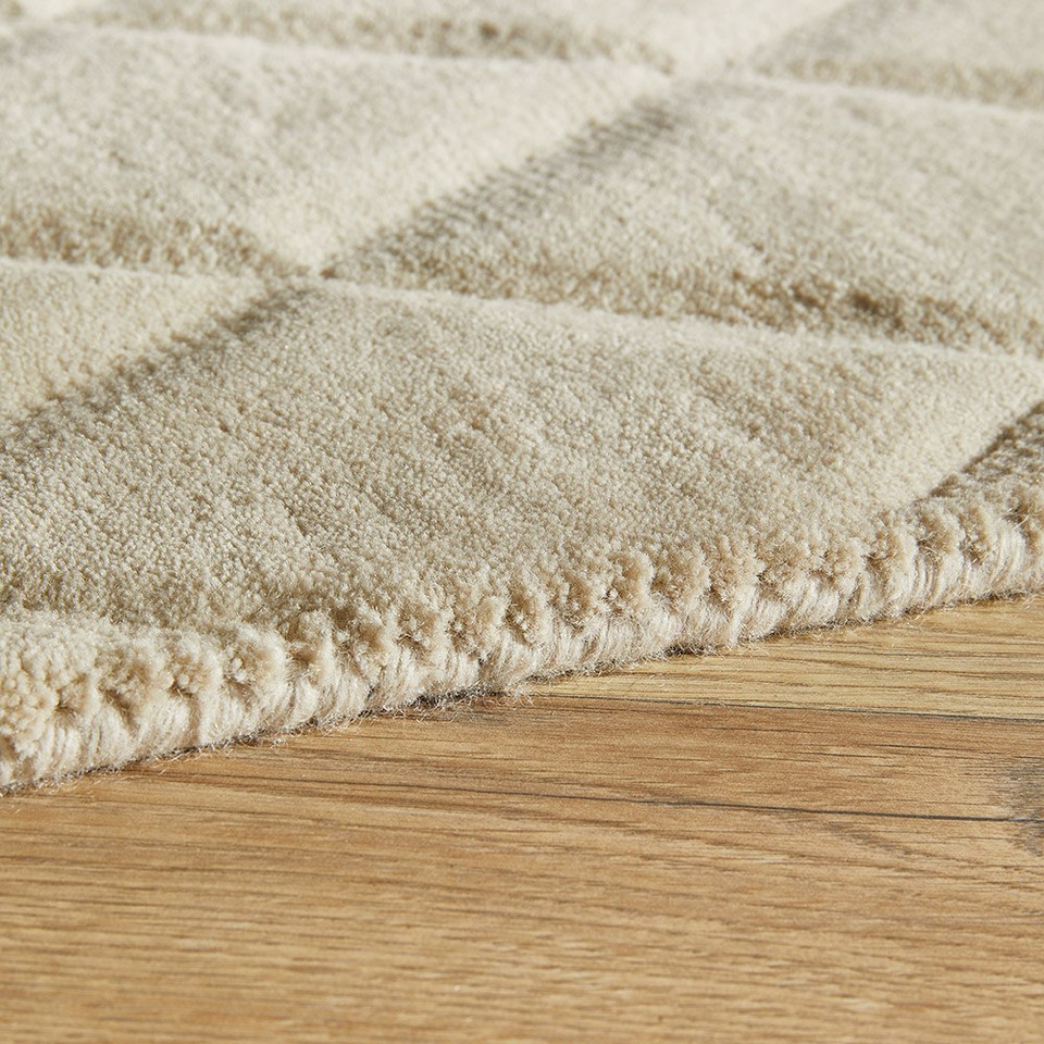 beige wool rug closeup edge