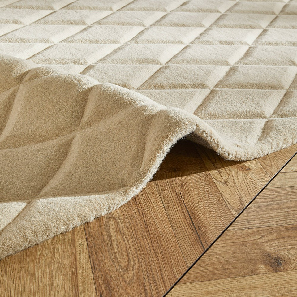 ivory wool rug closeup fold