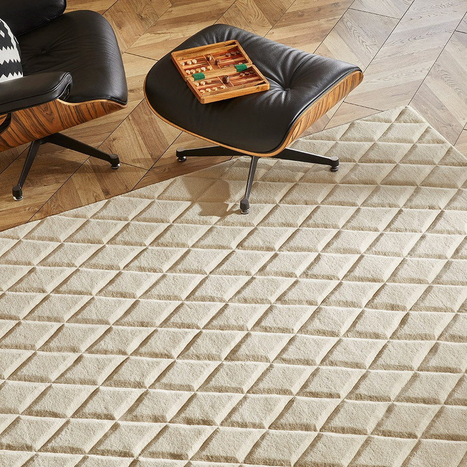 ivory wool rug in a living room with natural decor