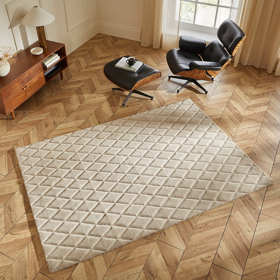 ivory wool rug in a living room with natural decor