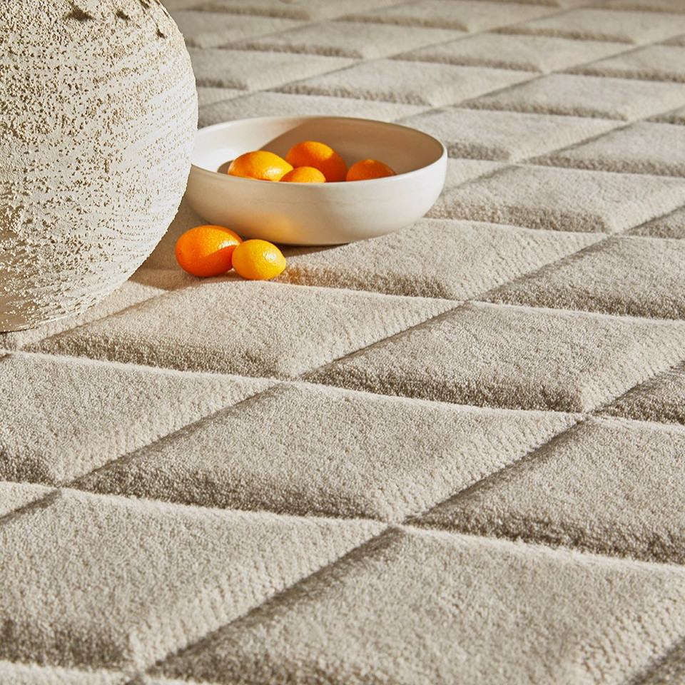 ivory wool rug closeup with bowl of fruit
