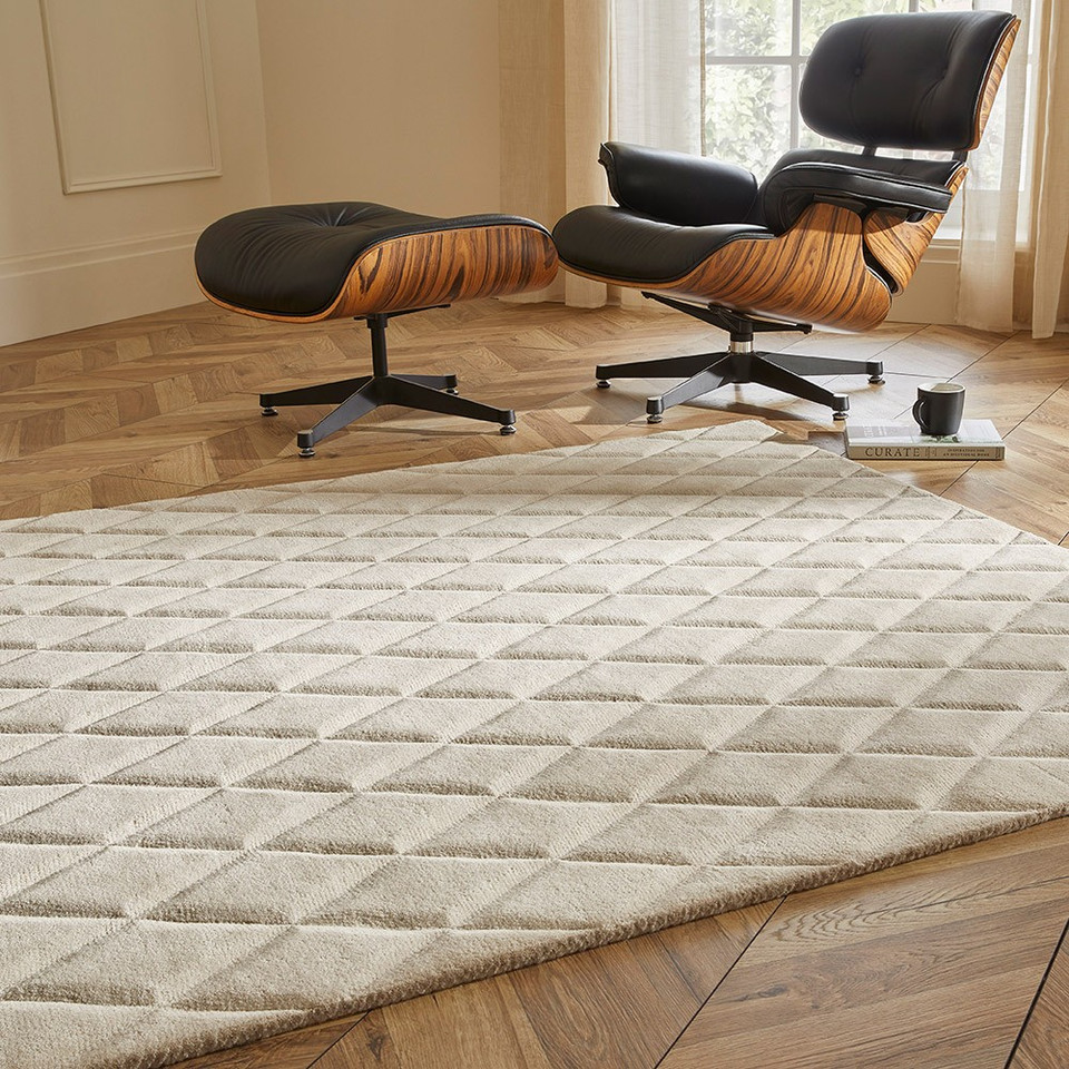 ivory wool rug in a living room with natural decor