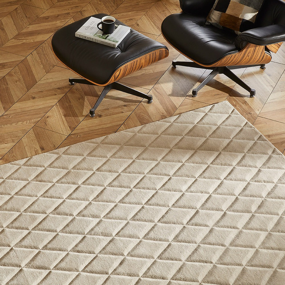 ivory wool rug in a living room with natural decor